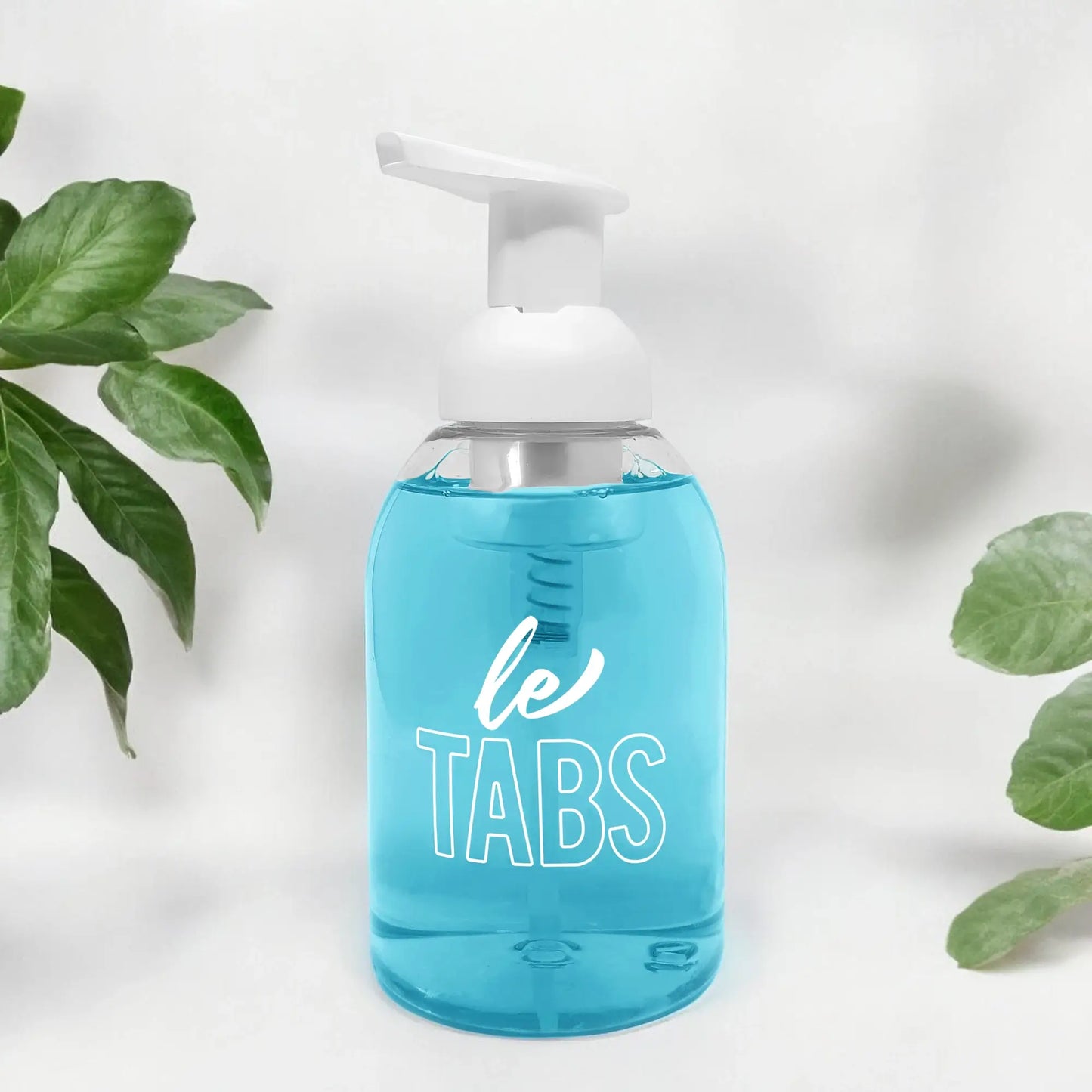 Dispensador com pastilha do sabão para mãos de fragrância Portofino num fundo branco